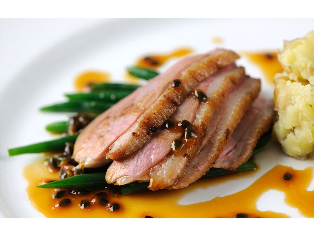 Duck breast with passion fruit sauce and crushed potatoes